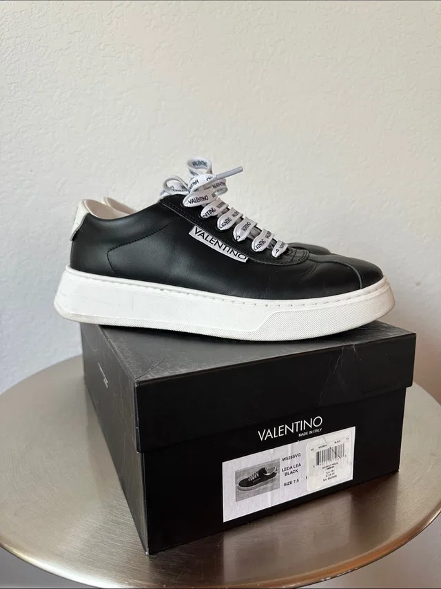 Valentino Garavani Black Leather Low-Top Sneakers With White Platform in black|white Leather from Poshmark