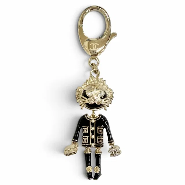 Chanel CC Logo Rhinestone Camellia Quilted Bag Lion Key Holder Bag Charm from The Reluxe