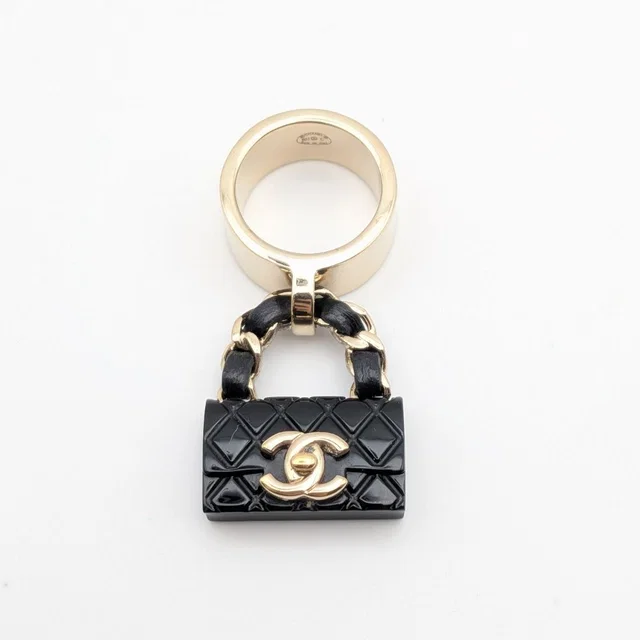 Chanel Ring CC Logo Turnlock Quilted Leather Bag Motif Black Gold 23c in Black Leather from The Reluxe