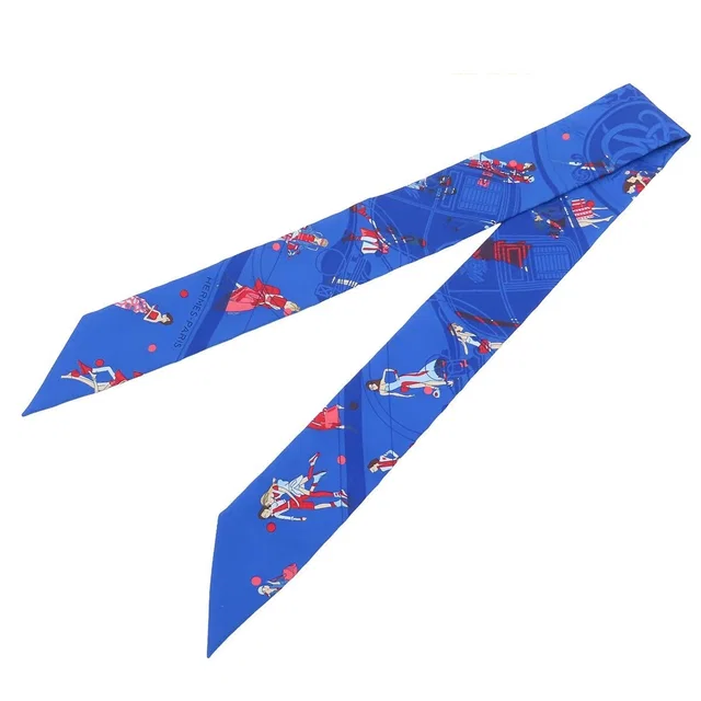 Hermès Twilly 02 Bleu Roy Blue Rouge Multicolor Silk Ex-Libris Parisienne Scarf in Red Silk from The Reluxe