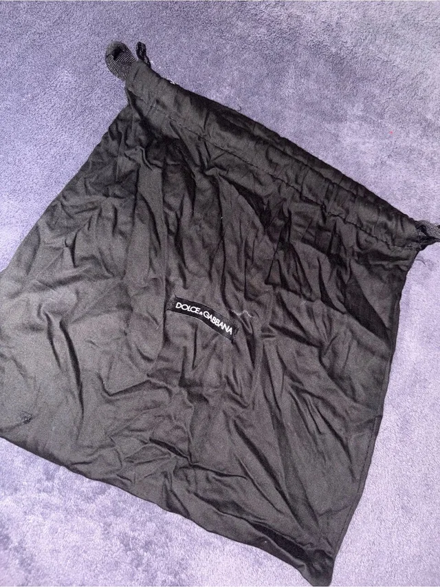Dolce & Gabbana Drawstring Dust Bag in black from Poshmark
