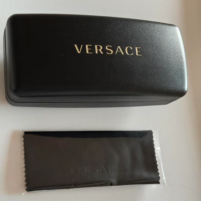 Versace Women's Sunglasses - Black/Brown in black|brown|red from Depop, photo 1 of 1