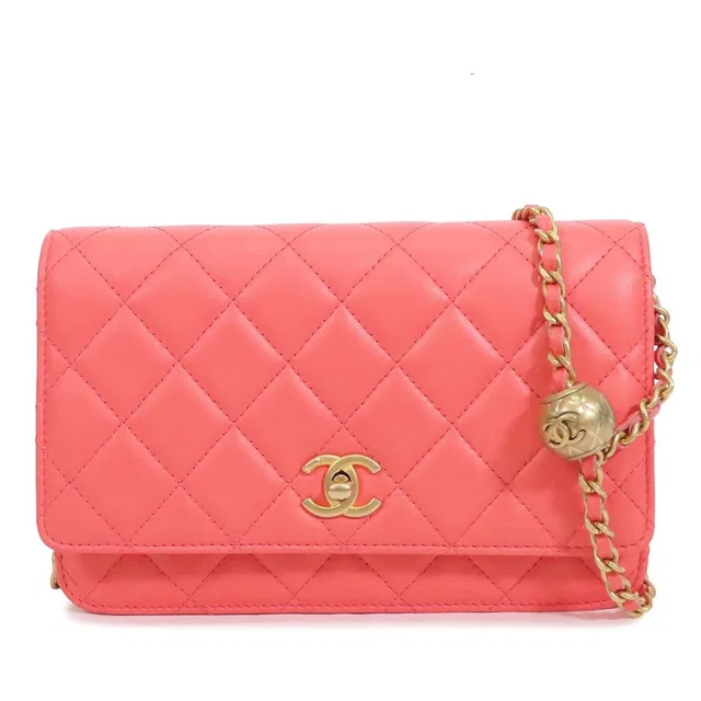 Chanel Chain Wallet Pink Gold Lambskin Quilted Pochette Coco Ball Shoulder Bag in Pink Lambskin from The Reluxe