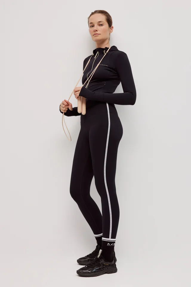 Athletica Logo Tape Ankle Length Legging 203 in Black from Aje, photo 1 of 1