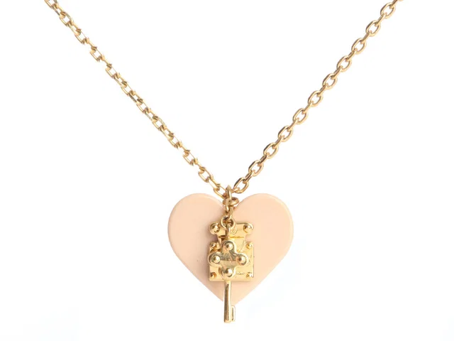 Louis Vuitton Rose Velours Lock Me Heart Necklace in Pink Resin from Ann's Fabulous Finds