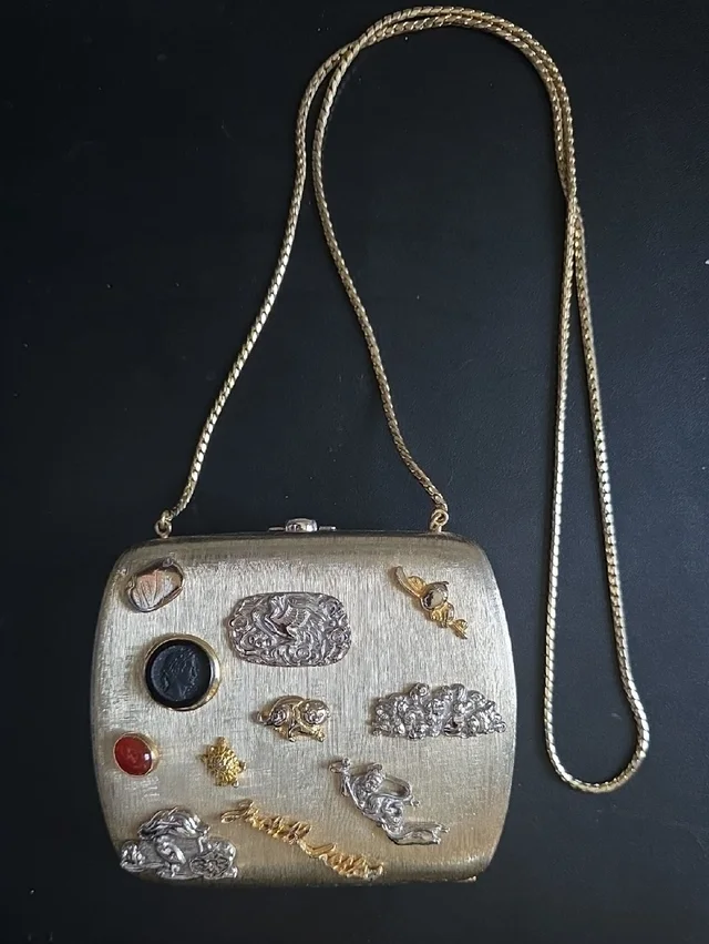 Judith Leiber Metal Evening Clutch With Sculpted Accents in gold from Poshmark