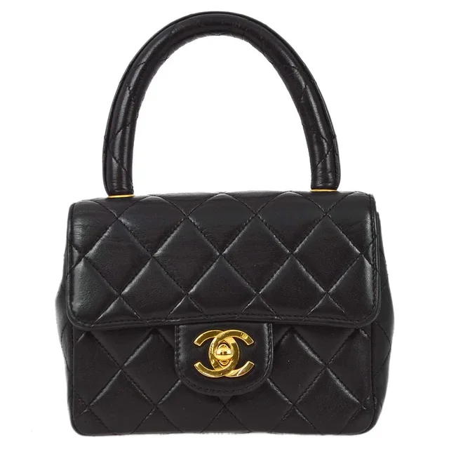 Chanel Black Lambskin Micro Classic Flap Handbag in Black Lambskin from AMORE Vintage Tokyo