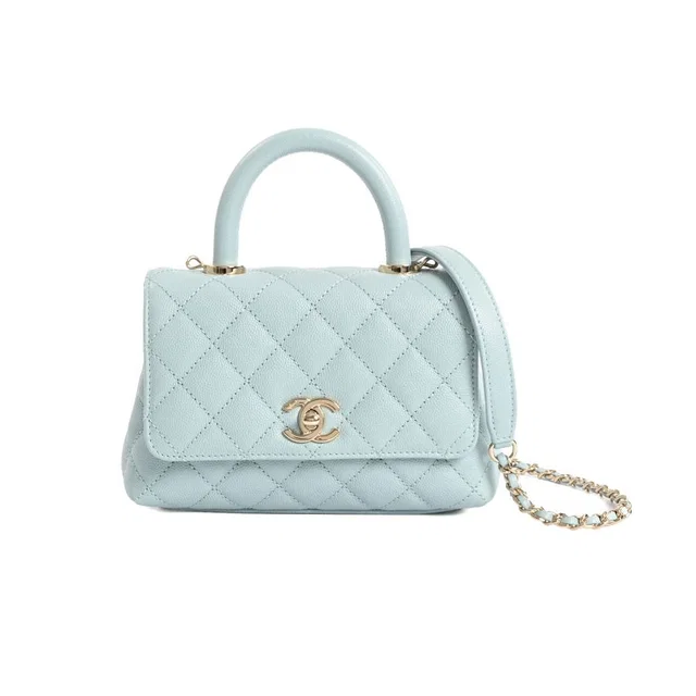 Chanel Handbag Top Handle Mini Flap Bag in Caviar leather from The Reluxe