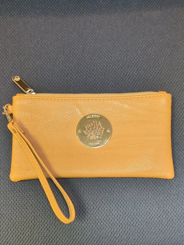 Mulberry Daria Wristlet in yellow|gold|red Leather from Poshmark, photo 1 of 1