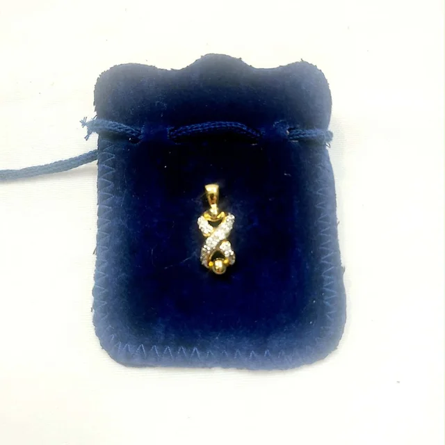 Valentino Garavani Gold Tone Crystal Crisscross Pendant in gold|white from Poshmark
