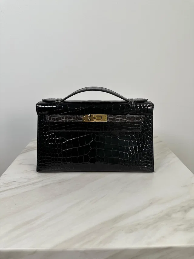 Hermès Kelly Pochette HSS Black/Graphite Shiny Alligator Gold Hardware in Black Crocodile from Luxury Promise