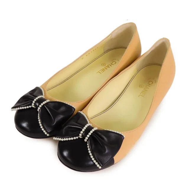 Chanel Ribbon Pumps Beige Black Leather Costume Pearl Round to Ro Heels in Black Leather from The Reluxe