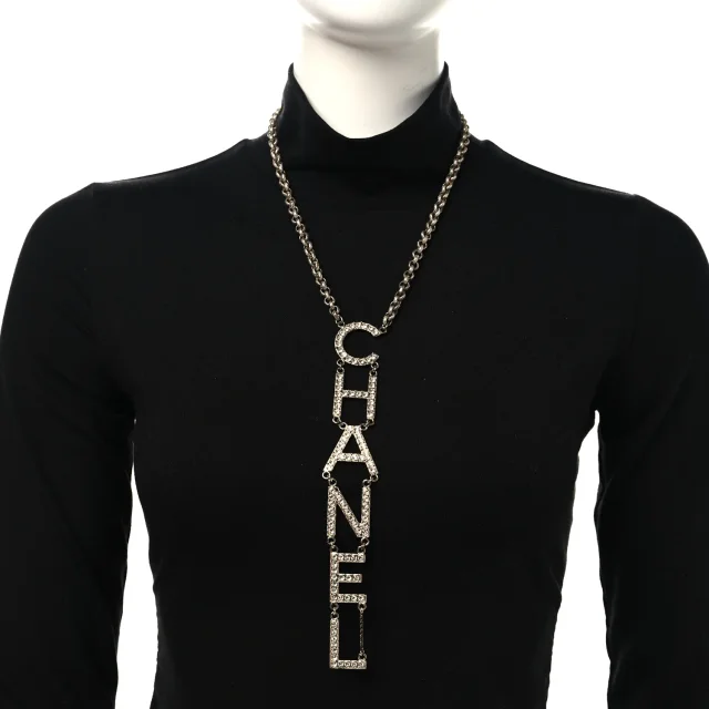 Chanel Metal Crystal Cha-Nel Logo Necklace Gold in Gold from FASHIONPHILE, photo 2 of 4