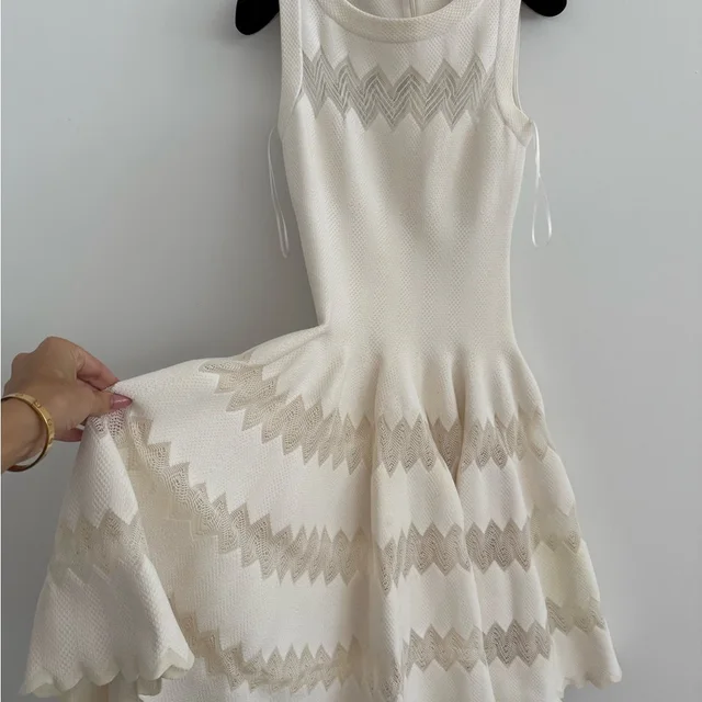 Alaïa Cream Knit Sleeveless Mini Dress With Chevron Cutouts in White from Poshmark