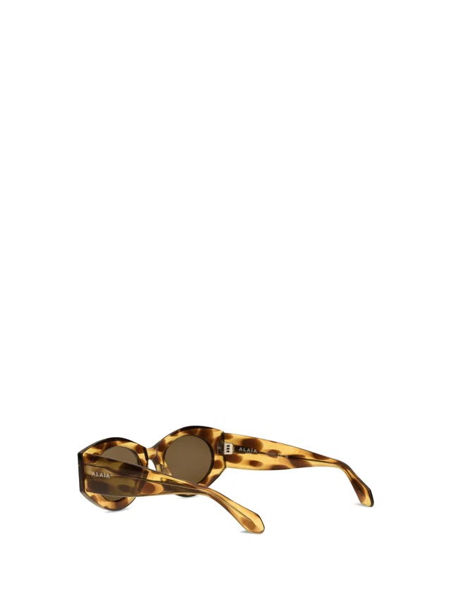 Alaïa Aa0080s006 Oval Acetate Sunglasses — Brown in Brown from HEWI