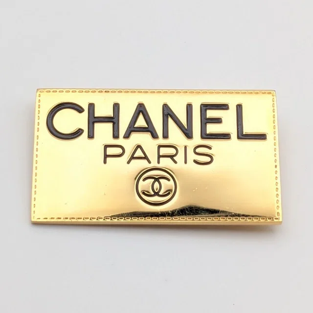 Chanel Brooch CC Logo Plate Gold First Era Vintage in Gold from The Reluxe