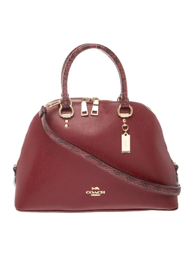 Coach Top Handle handbags in Leather from The RealReal