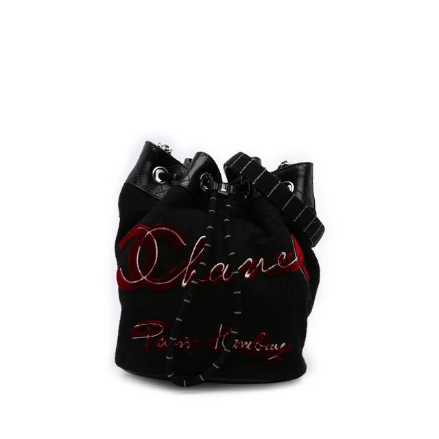 Black Chanel Paris Hamburg Wool Bucket Bag in Black Wool from Designer Revival, photo 1 of 1
