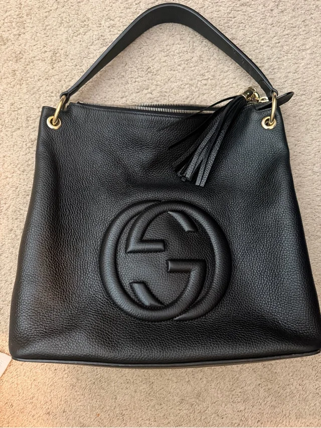 Gucci Pebbled Leather Shoulder Bag With Tassel in black Leather from Poshmark, photo 1 of 1