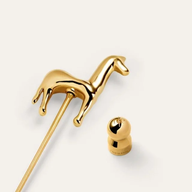 Loro Piana Women's Brooch - Gold in gold from Depop, photo 1 of 1