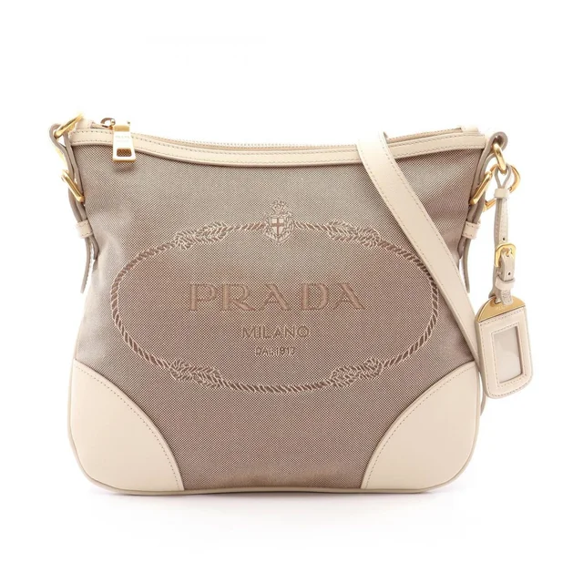 Prada Shoulder Bag Logo Jacquard Beige Ivory Canvas Leather in White Canvas from The Reluxe