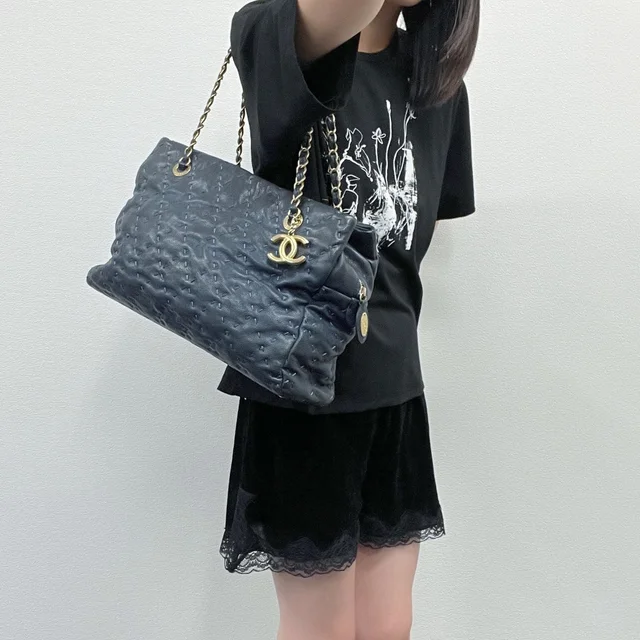 Chanel Camellia CC Logo Embossed Chain Tote Shoulder Bag Leather Navy Gold Seal in Navy Leather from The Reluxe