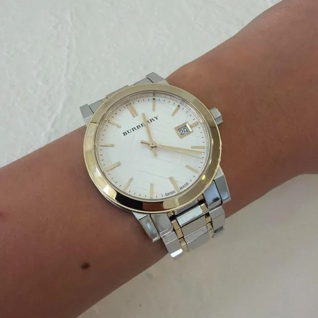 Burberry Women's Analogue Watch - Silver/Gold in gold|silver|gray from Depop, photo 1 of 1