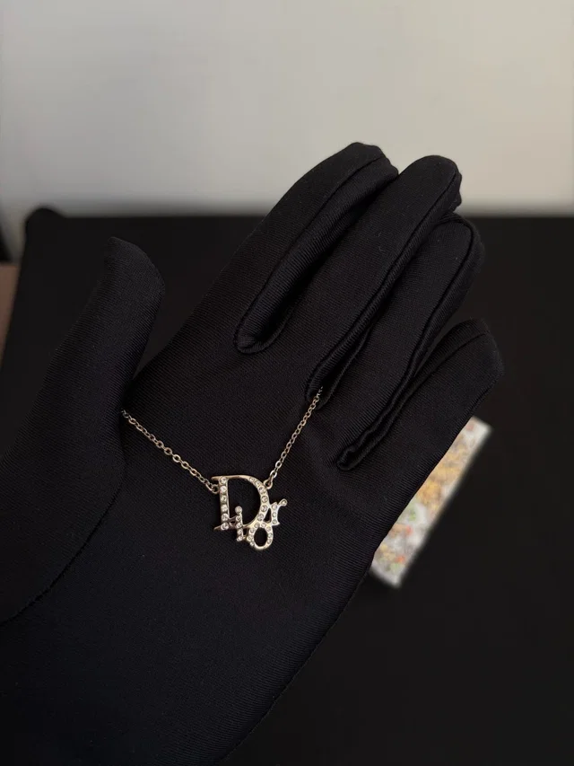 Dior Silver Crystal Logo Letter Necklace in Silver from Luxury Promise, photo 1 of 1