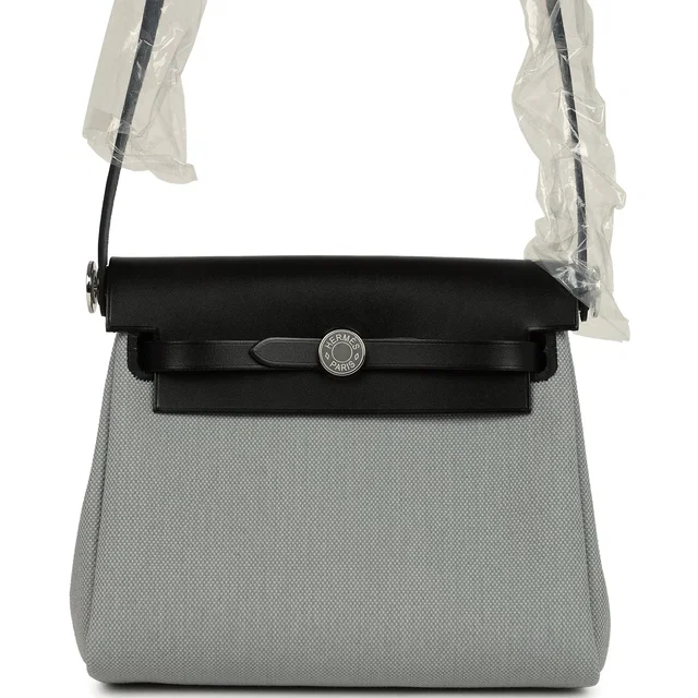Hermès Herbag Zip 20 Mini Gris Pantin Toile Militaire Canvas and Black Vache Hunter Palladium Hardware in Black Canvas from Madison Avenue Couture