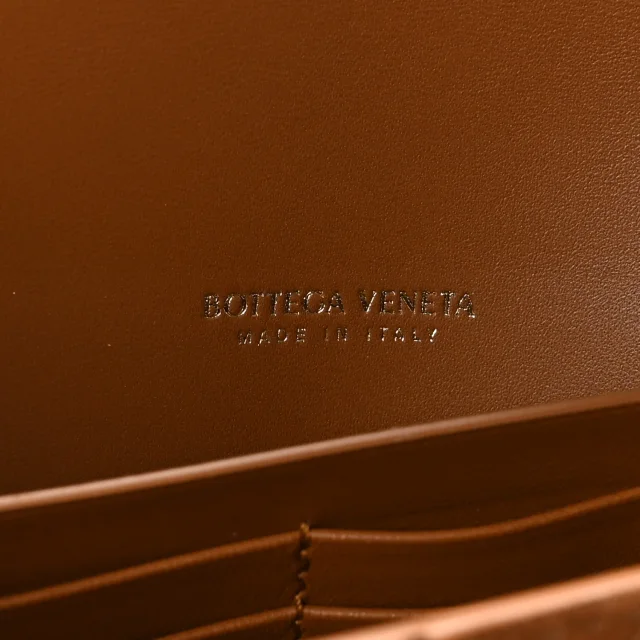 Bottega Veneta Intrecciato Long Andiamo Top Handle Clutch Amber in Suede from FASHIONPHILE, photo 6 of 8
