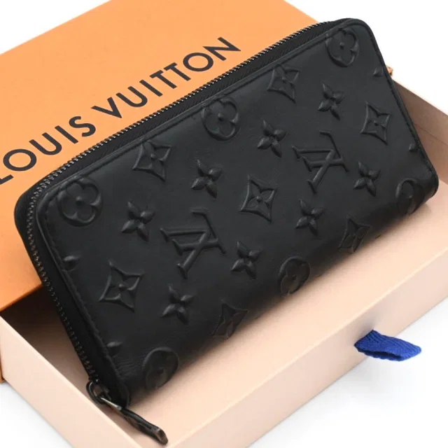 Louis Vuitton Monogram Seal Zippy Wallet Vertical Black in Black Leather from The Reluxe