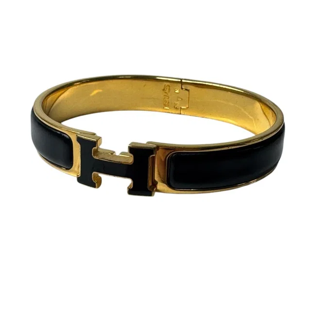 Hermès Clic Clac Bracelet Black Gold in Black from The Reluxe