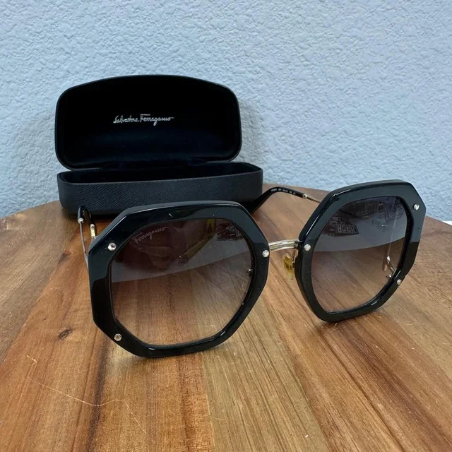 Ferragamo Women's Oversized Sunglasses - Black/Gold in gold|black from Depop, photo 1 of 1