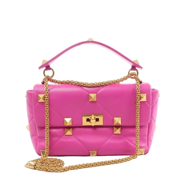 Valentino Garavani Roman Studs Leather 2-way Crossbody Bag in pink Leather from Her-Age, photo 1 of 1