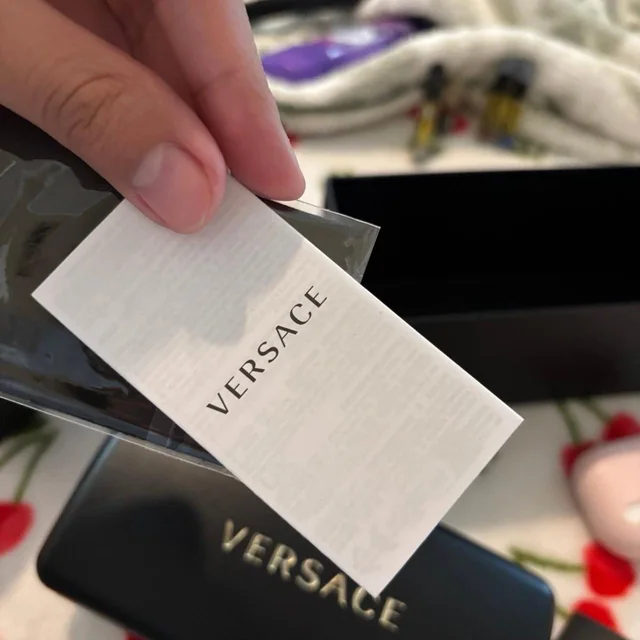 Versace Women's Oversized Sunglasses - Black in black from Depop, photo 5 of 9