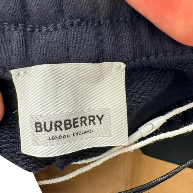 Burberry Equestrian Knight Patch Sweatpants in Black Cotton in black, photo 6 of 6 from ShopSimon