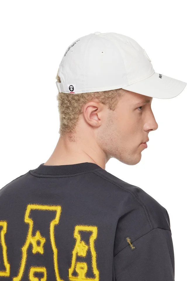 AAPE by A Bathing Ape Off-White AAPENOW Moonface Cap, photo 3 of 3 from SSENSE
