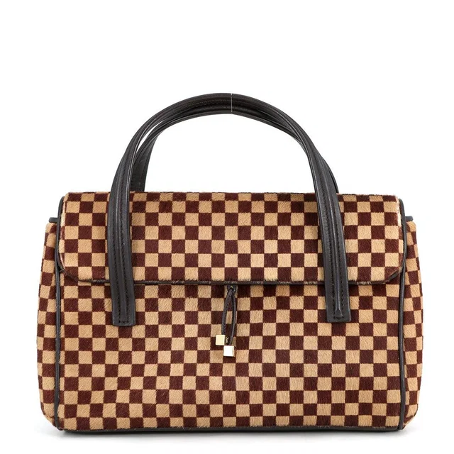 Louis Vuitton Handbag Damier Sauvage Calf Hair Lion from The Reluxe