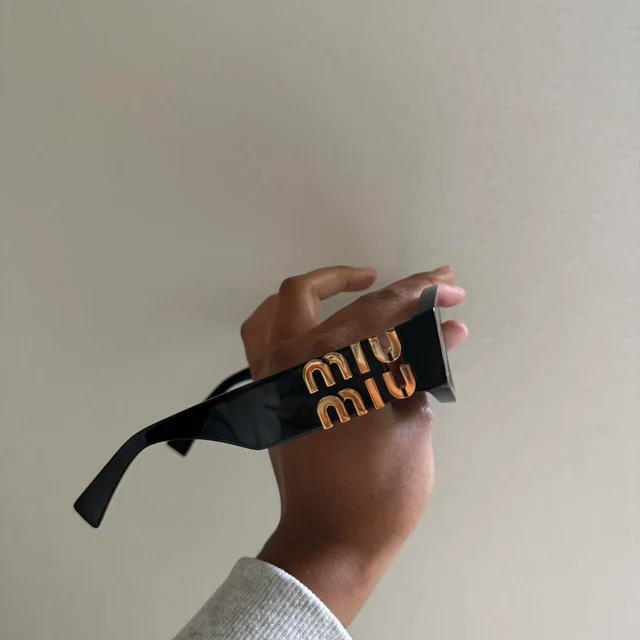 Miu Miu Women's Sunglasses - Black in black from Depop, photo 2 of 8