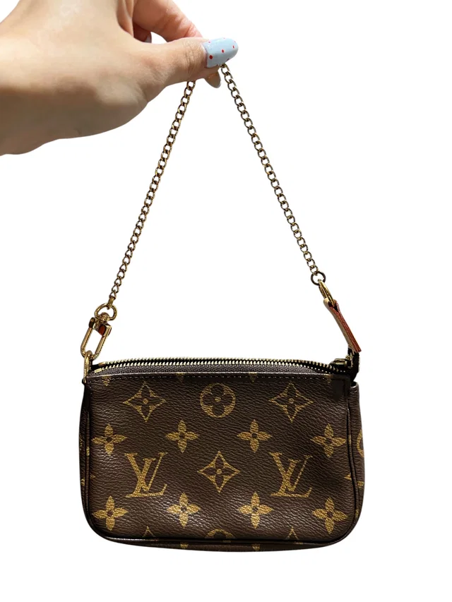 Louis Vuitton Pochette Accessoires Marron Coated Canvas Accessory Pouch in Brown Coated canvas from Luxury Promise