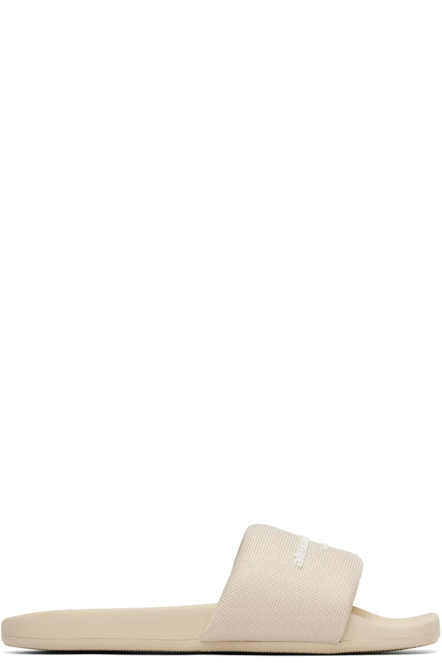 Alexander Wang Beige 'AW' Pool Slides from SSENSE, photo 1 of 1
