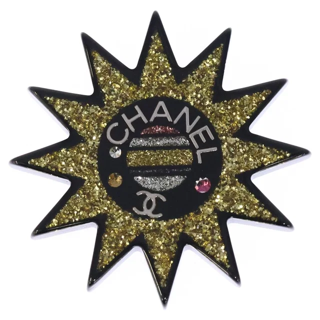 Chanel Sun Motif Rhinestone Brooch Pin Badge Black Yellow Resin Strass in Black Resin from The Reluxe