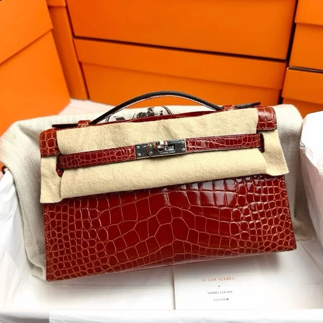 Hermès Kelly Pochette Miel Shiny Alligator PHW #T in Crocodile from Luxury Promise