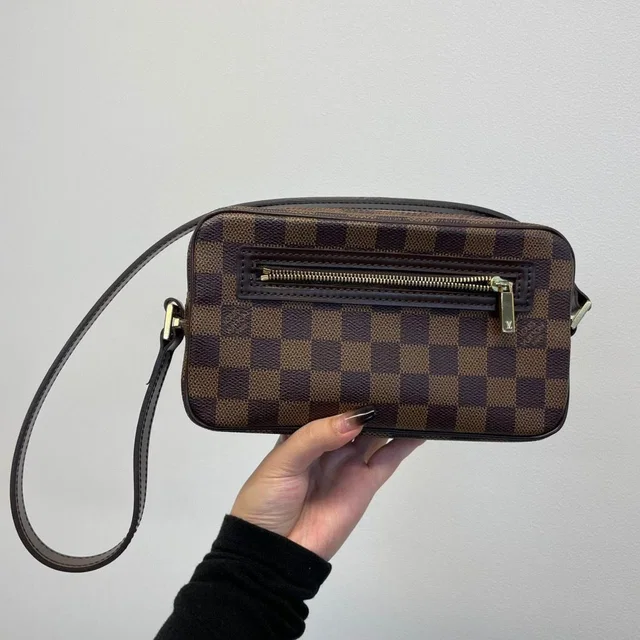Louis Vuitton Pochette Cite Shoulder Bag in Coated canvas from The Reluxe