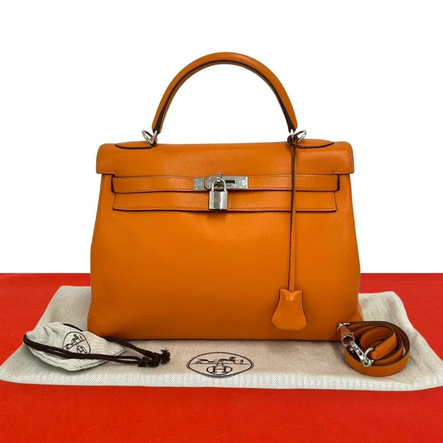 Hermès Kelly 35 Chevre Leather 2-Way Shoulder Bag Orange in Orange Goatskin from The Reluxe