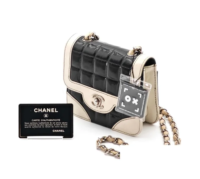 Chanel Choco Bar Mini Chain Mini Shoulder Bag Black White in Black Leather from The Reluxe