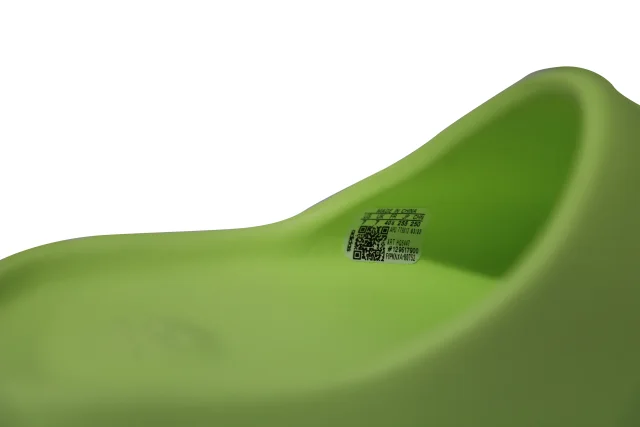 Adidas Yeezy Slides in Glow Green Plastic in green, photo 5 of 6 from ShopSimon
