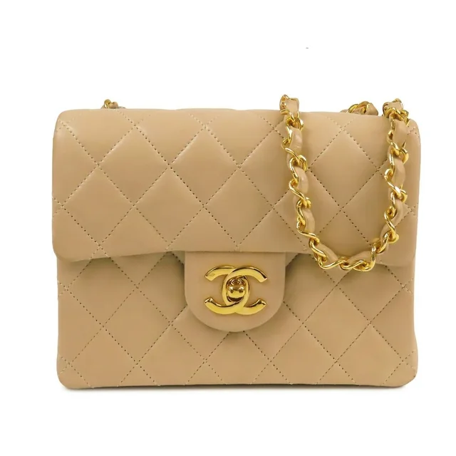 Chanel Chain Shoulder Bag Beige Gold Lambskin Mini Quilted Vintage in Beige Lambskin from The Reluxe