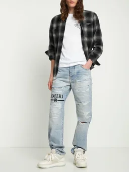 Amiri Flare jeans with ripped details in 100% Cotton, photo 2 of 5 from LUISAVIAROMA