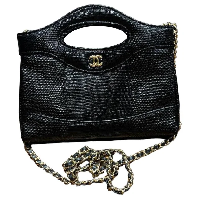 Chanel 31 Metiers D’art Black Flap bag with chain in Black from HEWI